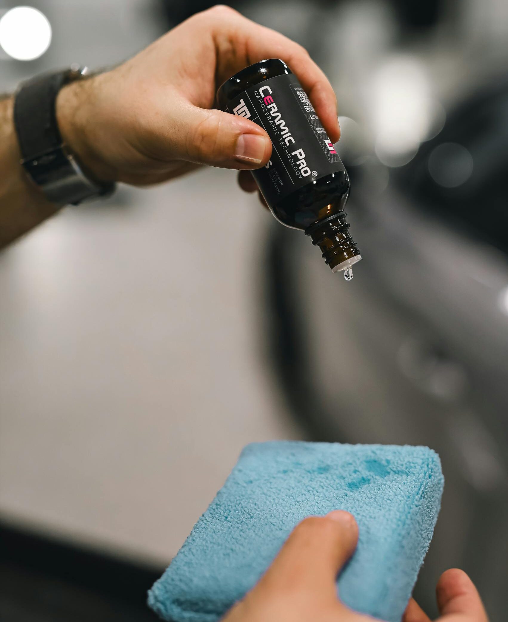 A person using a car wash to clean a car