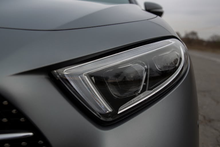 Switched off headlight of new expensive automobile